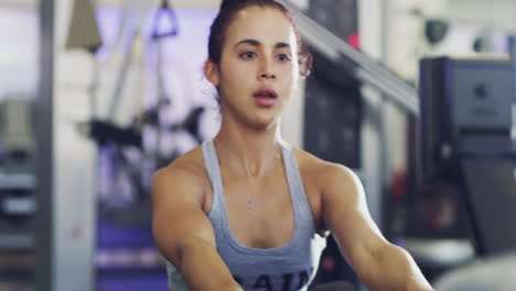 Serious,-fit-and-active-woman-sweating-at-the-gym