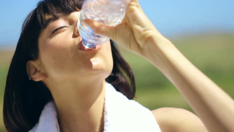 Wellness,-workout-or-exercise-woman-drinking-water