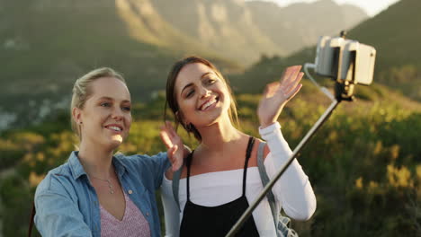 two-female-best-friends-taking-a-selfie-using