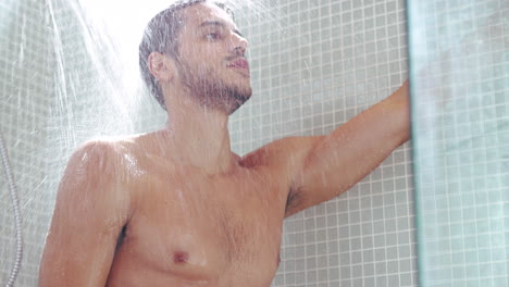 a-handsome-young-man-having-a-refreshing-shower