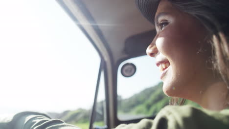 Woman,-smile-and-road-trip-looking-out-window