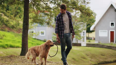 a-handsome-young-man-walking-with-his-dog