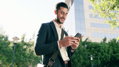 a-handsome-young-businessman-using-a-mobile-phone