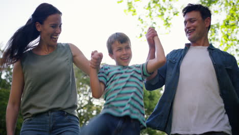 a-little-boy-having-fun-with-his-parents-outdoors