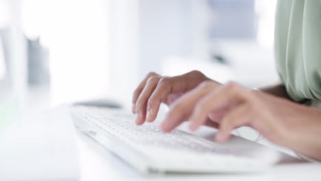 Female-hands-typing-an-email-on-her-computer