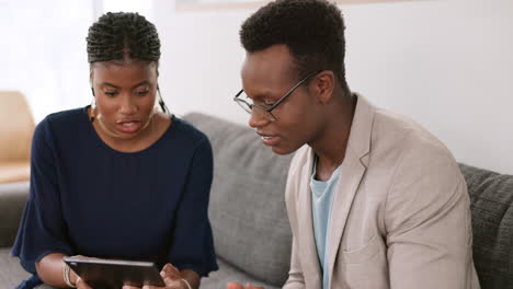 Tablet,-black-woman-and-black-man-in-a-meeting