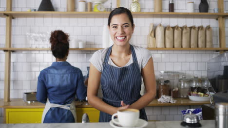 an-attractive-young-female-barista-serving-you