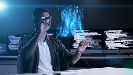Man,-programming-and-futuristic-hologram-at-night