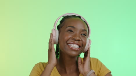 Headphones,-excited-black-woman-dancing-in-studio