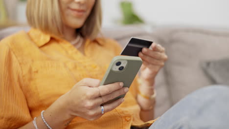 Cellphone,-credit-card-and-lady-on-a-sofa-doing
