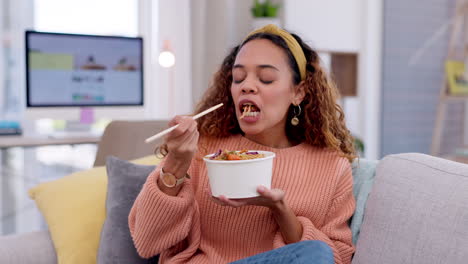 Woman,-eating-fast-food-and-noodles-on-couch