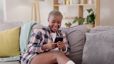 Laugh,-relax-and-phone-with-black-woman-on-sofa