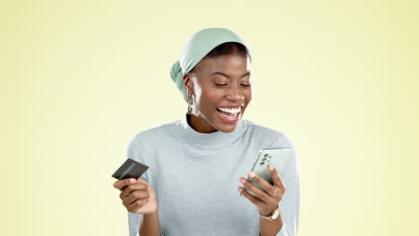 Cellphone,-credit-card-and-black-woman-in-a-studio