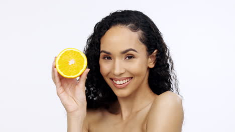Orange-fruit,-skincare-and-face-of-woman