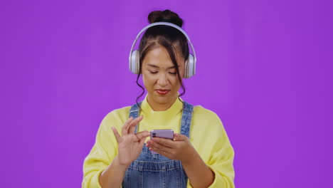 Scrolling,-music-and-phone-with-asian-woman