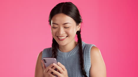 Laugh,-phone-and-text-message-with-asian-woman