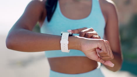 Fitness,-tracker-and-hands-of-woman-with-smart