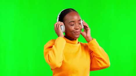 Dance,-happy-and-black-woman-with-music-on-a-green