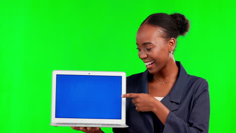 Black-woman,-laptop-and-pointing-on-mockup-green