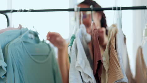 Creative-woman,-fashion-and-checking-clothing-rack