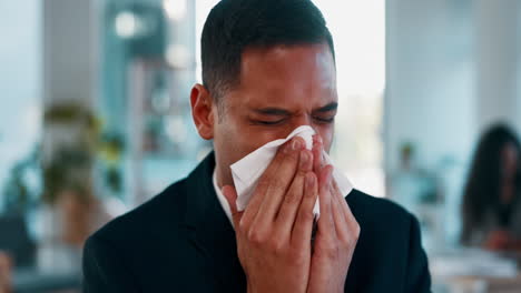 Sick,-desk-and-man-blowing-nose-with-tissue