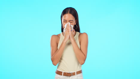 Tissue,-blow-nose-and-woman-isolated-on-a-blue