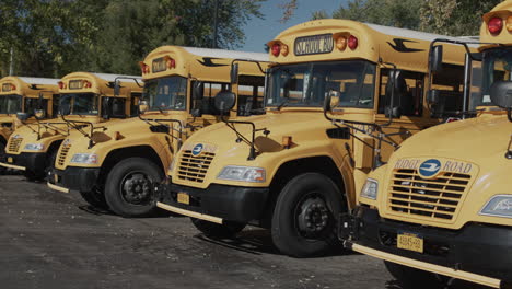 Wilson,-NY,-USA,-October-2021:-A-row-of-yellow-school-buses-stand-in-the-parking-lot