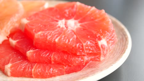 Fresh-grapefruits-on-a-plate-,