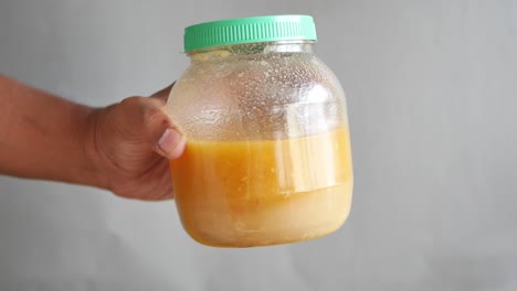 Homemade-ghee-in-container-on-a-table