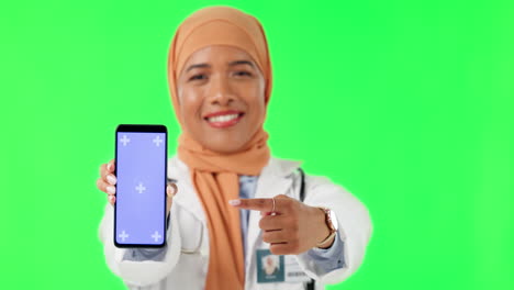 Muslim-woman,-doctor-and-pointing-to-phone-mockup