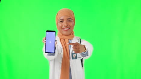 Muslim-woman,-doctor-and-pointing-to-phone