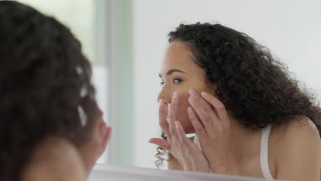 Cosmetics,-mirror-and-woman-with-skincare