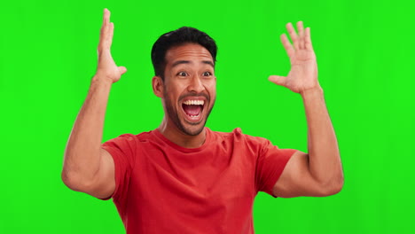 Shock,-celebration-and-man-in-a-studio-with-green