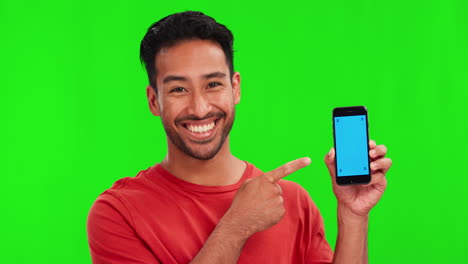 Man,-face-and-point-at-cellphone-by-green-screen
