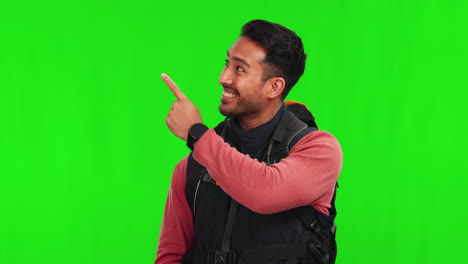 Asian-man,-backpack-and-pointing-on-green-screen