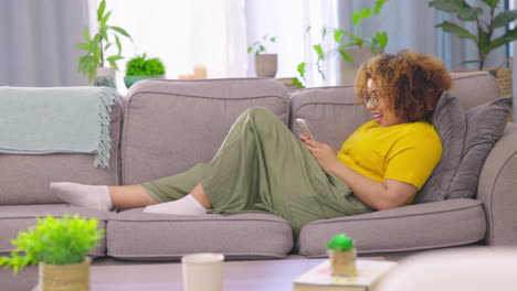 Relax,-texting-and-woman-with-phone-on-a-sofa