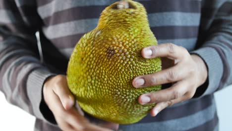 Men-holding-a-jackfruits-close-up