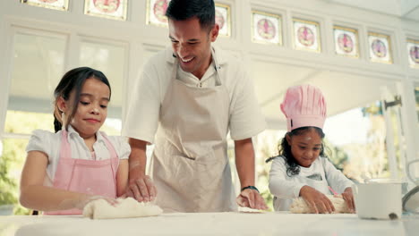 Baking,-dough-and-a-dad-teaching-his-girls