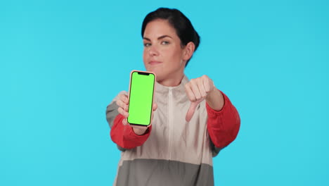 Woman,-thumbs-down-and-phone-green-screen