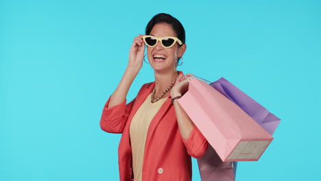 Sunglasses,-shopping-bag-or-happy-woman-with-gift
