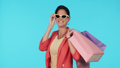 Sunglasses,-shopping-bags-or-face-of-happy-woman