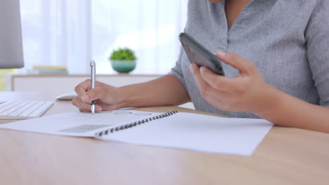 Woman,-writing-and-documents-with-phone