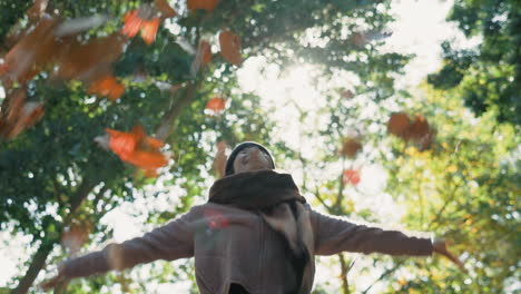 Woman,-autumn-and-throwing-leaves-outdoor