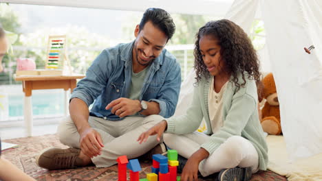 Building-blocks,-home-and-father-with-his-girls