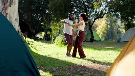 Nature,-camping-and-young-couple-dancing-together