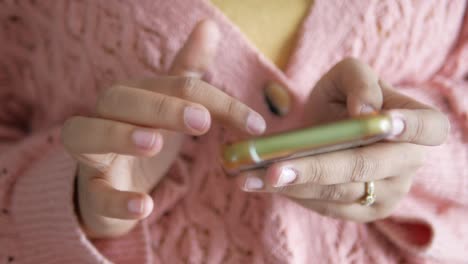 Close-up-of-women-hand-holding-smart-phone