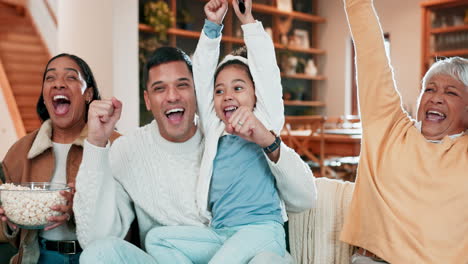 Celebrate,-popcorn-and-family-on-a-sofa-at-home-to