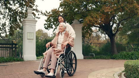 Senior-woman,-wheelchair-and-caregiver-in-park