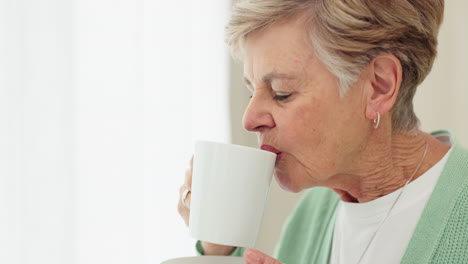 Senior-woman,-drinking-coffee