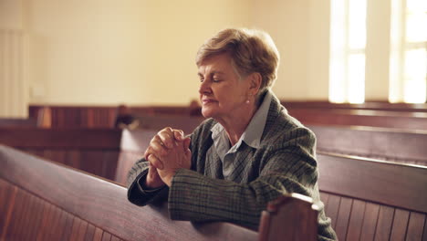 Senior,-woman-and-praying-in-church-for-faith